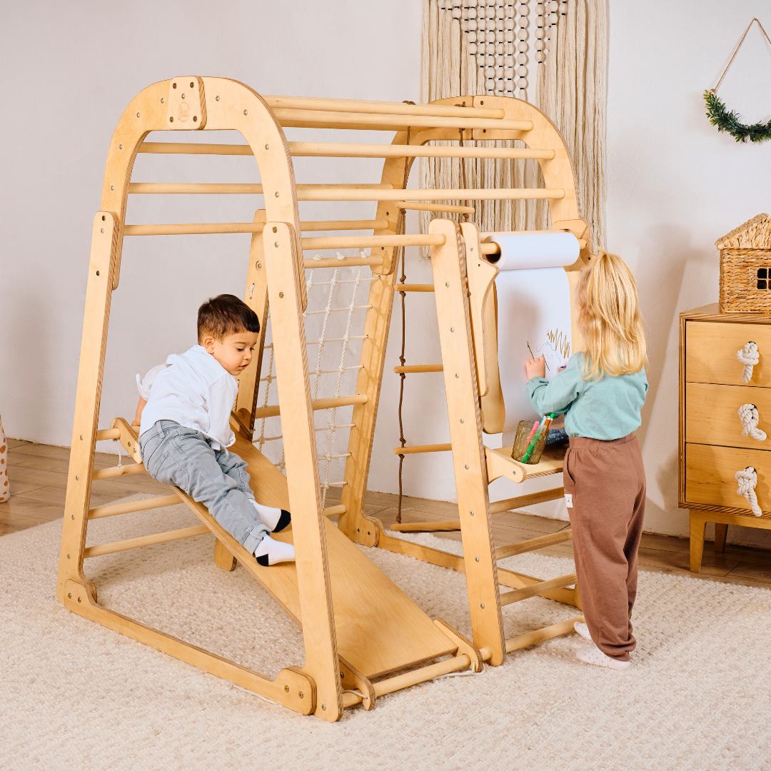7-in-1 Indoor Playground for Toddlers: Playhouse, Swings, Slide, Rope Ladder, Rock Wall, Net & Art Station